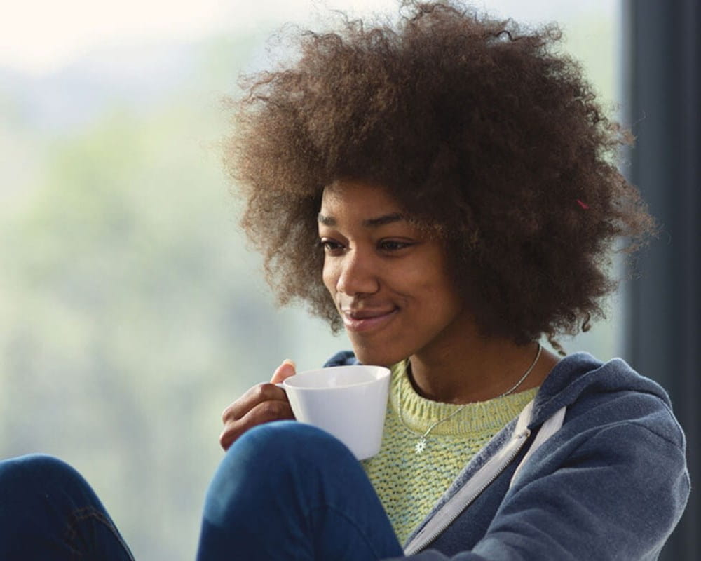 Woman looking at computer and smiling