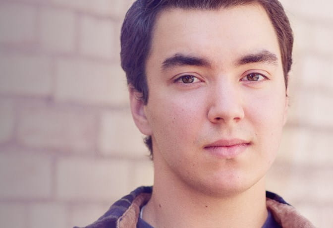 Young white man looking at camera