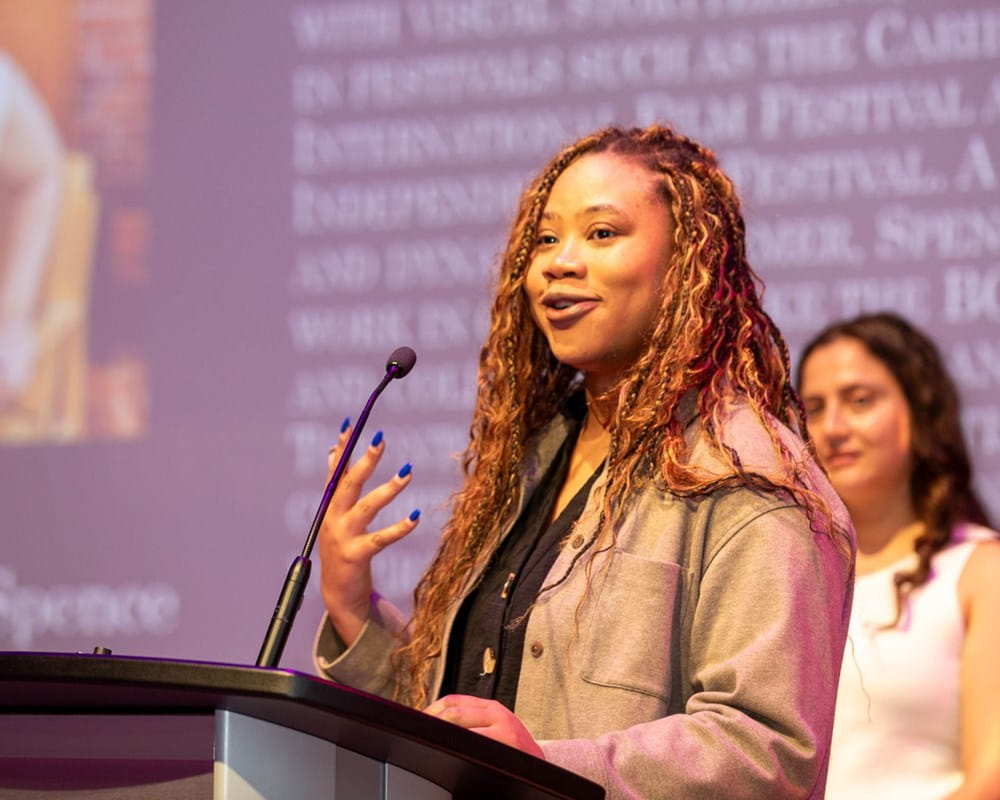 Affrica Spence performs spoken word poetry to audience