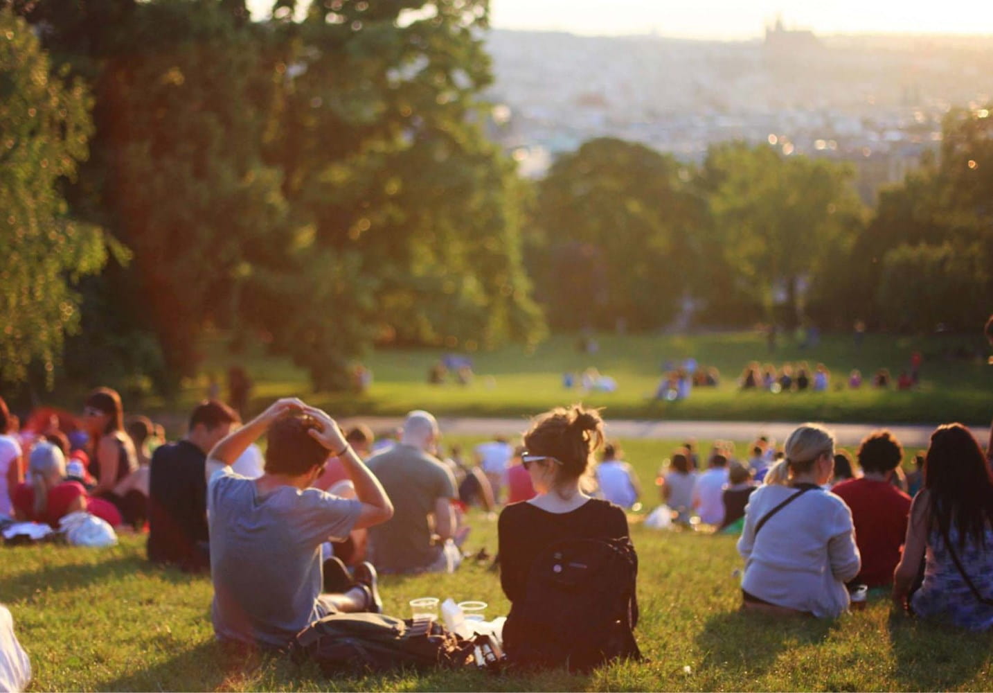 Group of people sitting in a park