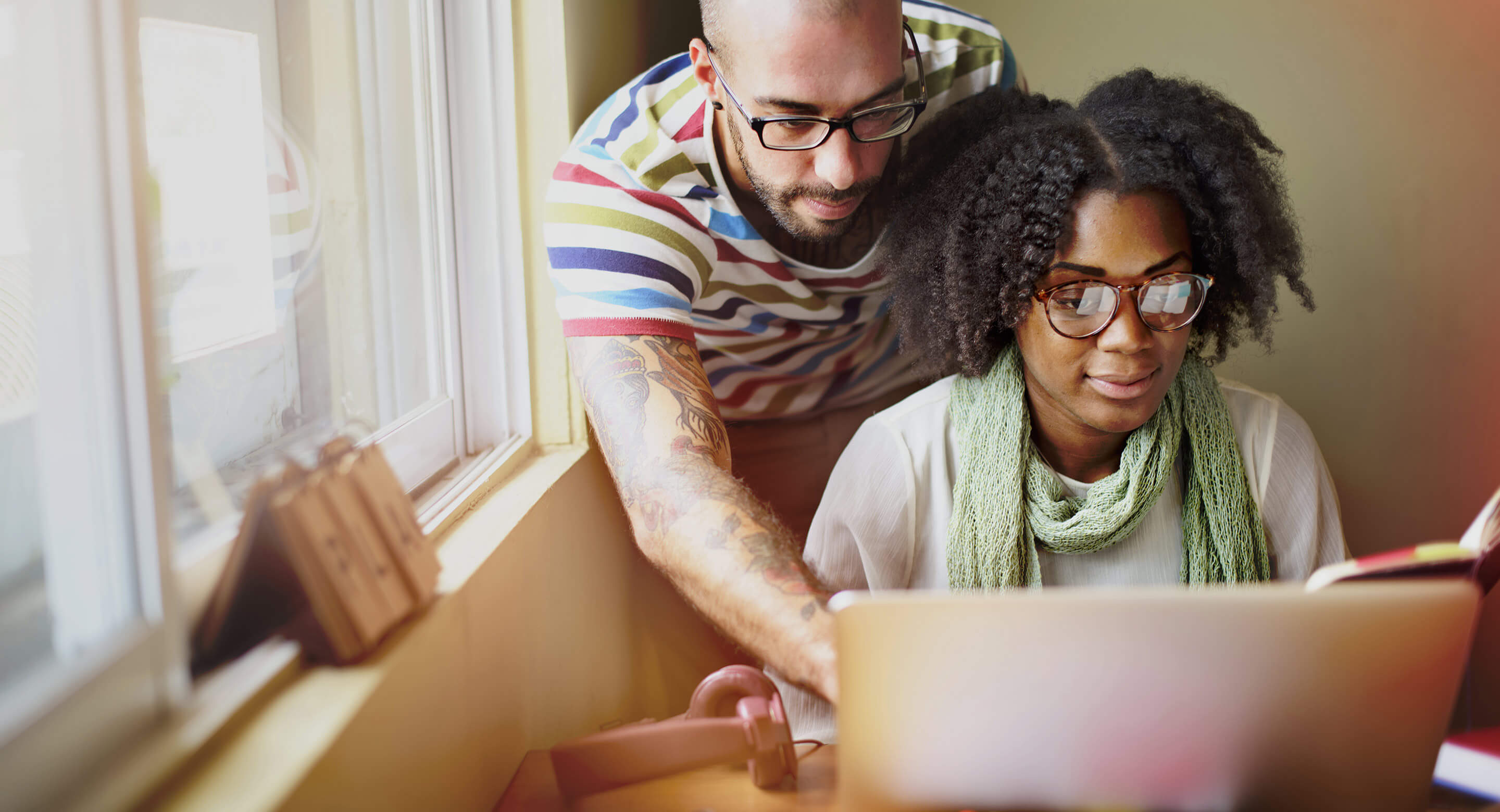 Couple in front of a laptop