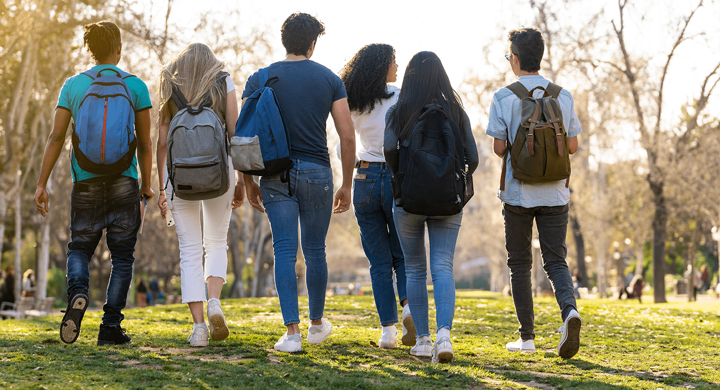 Group of teens walking in park