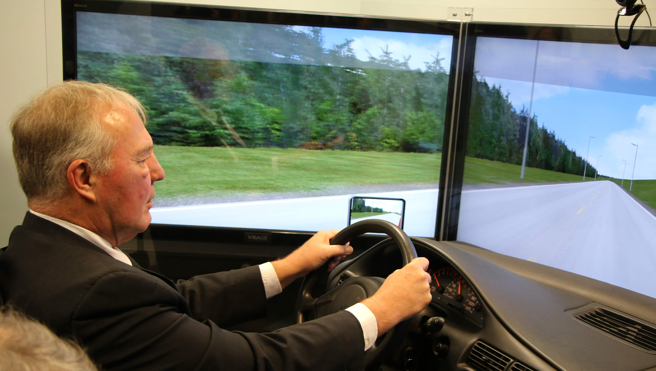 MP Bill Blair using CAMH’s driving simulator.