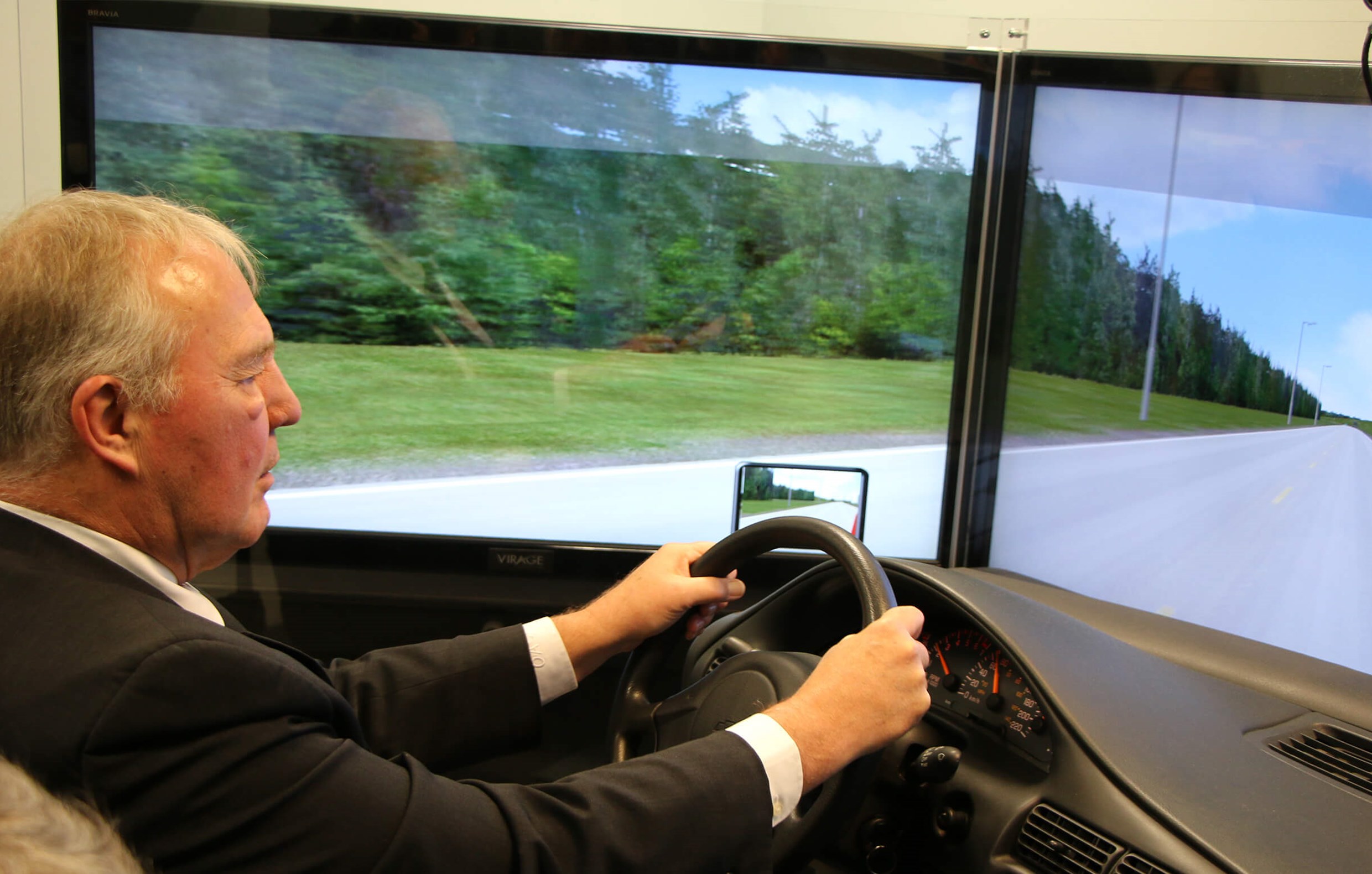 MP Bill Blair using CAMH’s driving simulator.