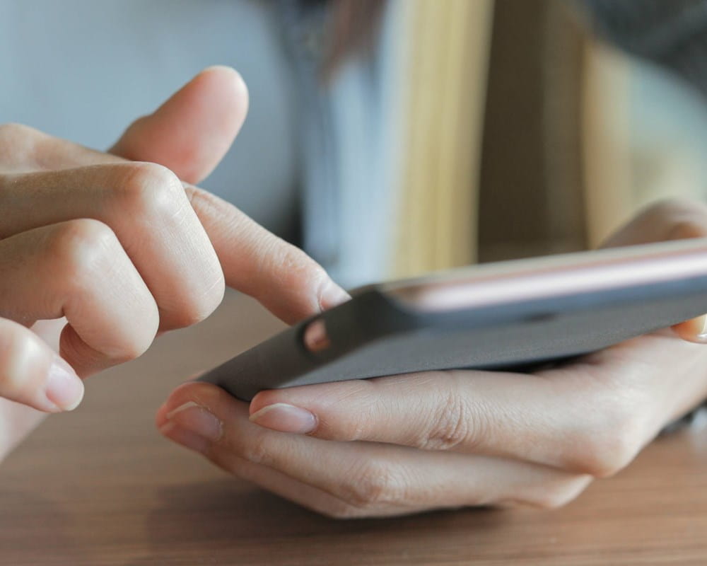 Close-up of person using phone