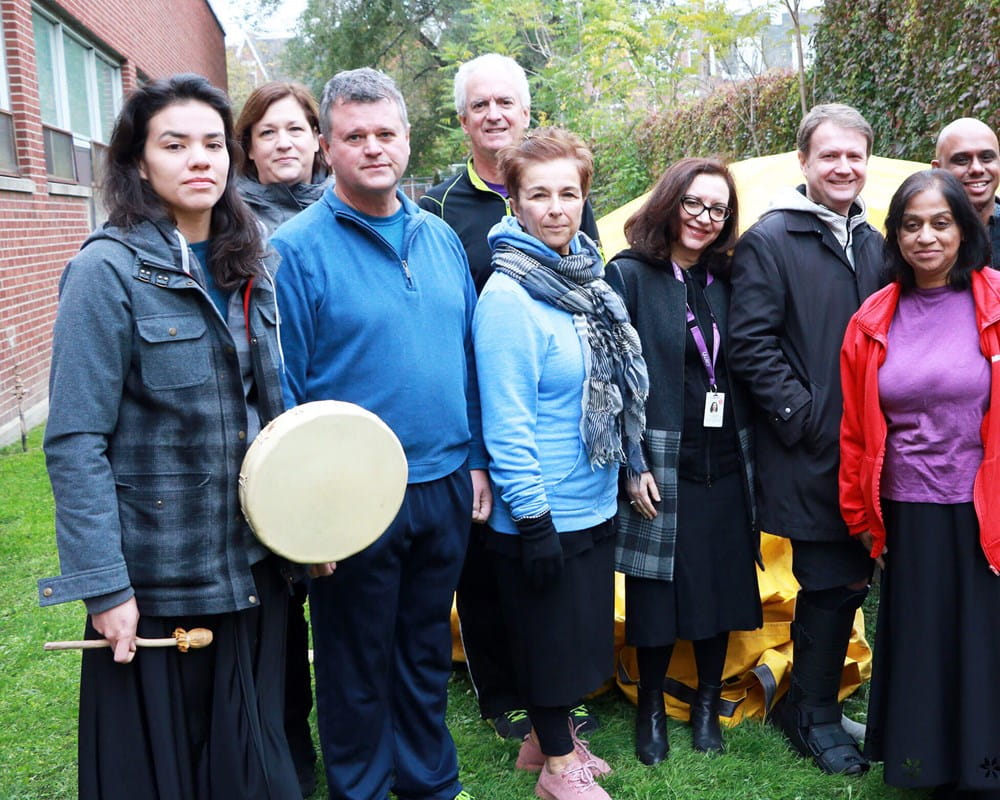 ELT members in front of Sweat Lodge