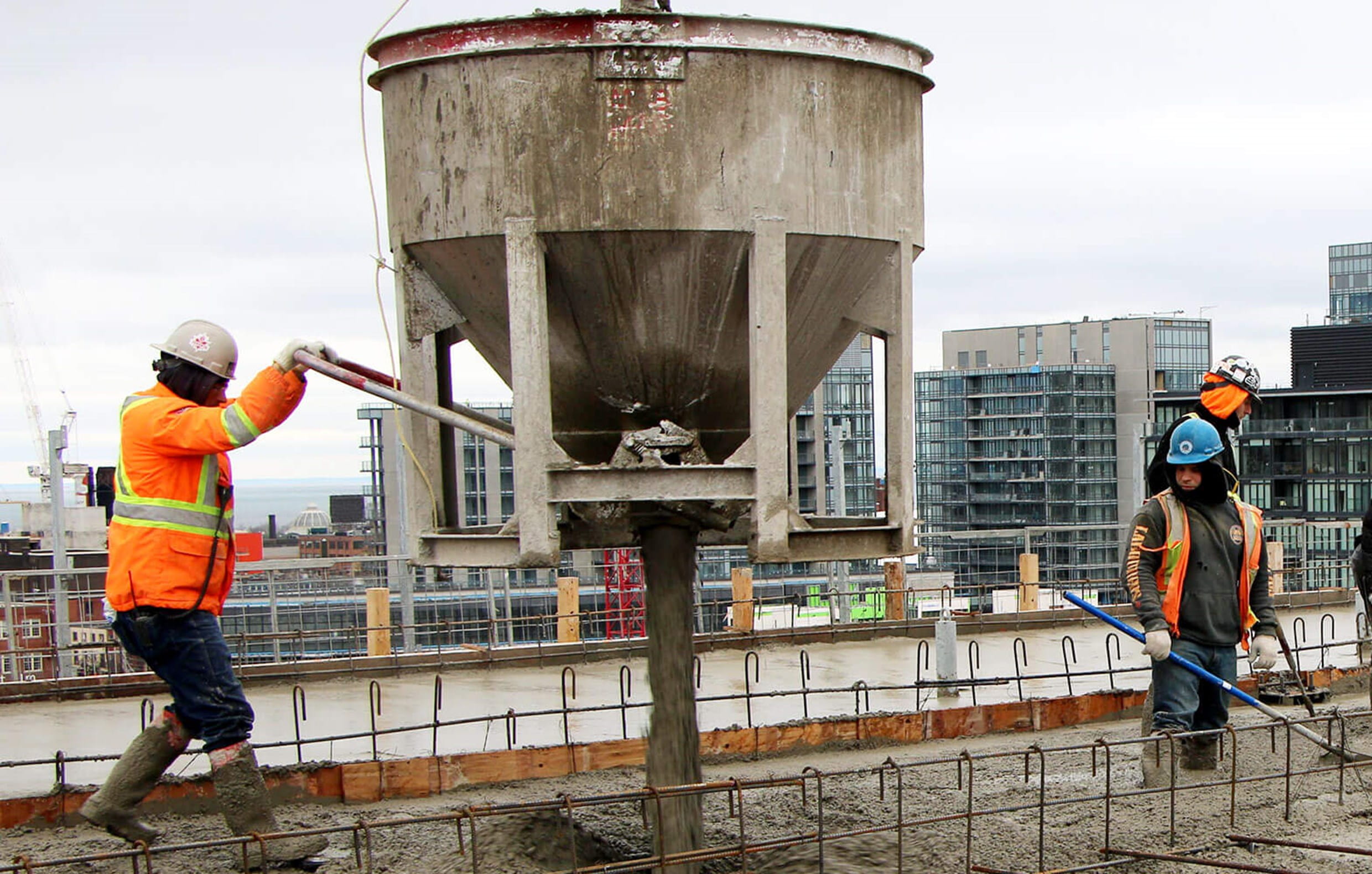 Man pouring concrete - top-off Phase 1C Man pouring concrete - top-off Phase 1C