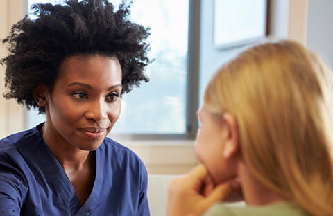 Nurse listening to a teen. 