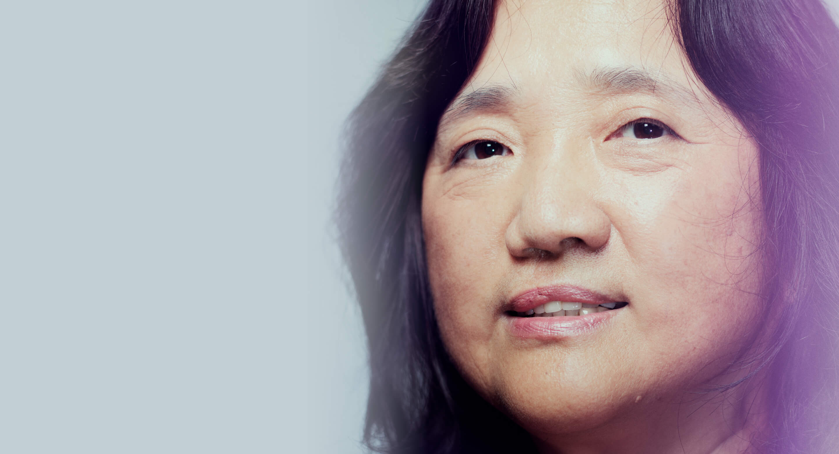 A close up picture of Dr. Feng Liu looking at the camera