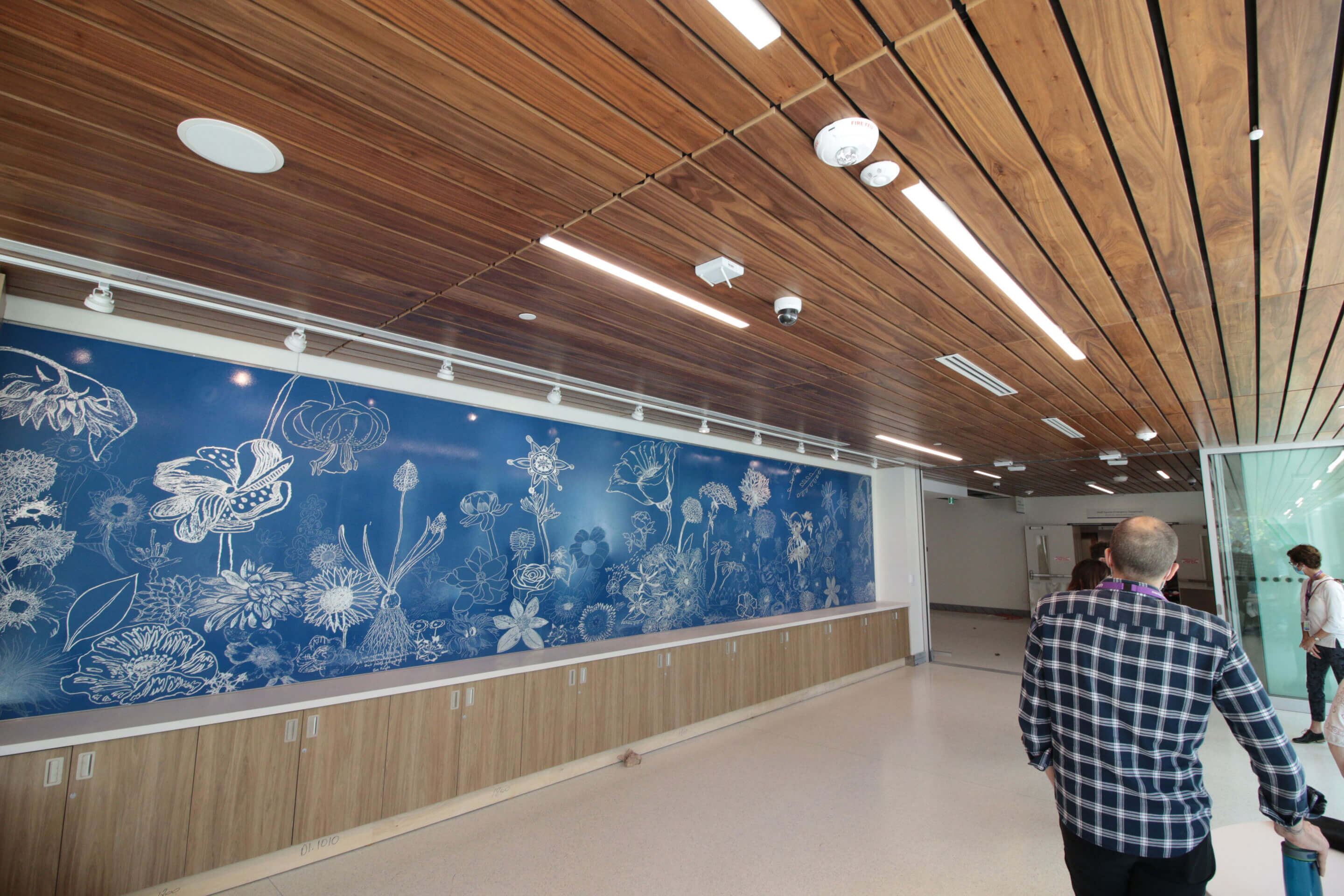 Artist: Dave Hind | Title: The Garden Within | Location: Patient Gathering Space, Crisis & Critical Care Building | Description: Developed in collaboration with CAMH patients. Bringing the garden inside the building; emphasizing the calming and grounding effect that nature has on us.  The interior garden is also a metaphor for our inner psychological and spiritual selves providing a setting to tell our stories.  Drawings submitted by participants will make up the garden image.