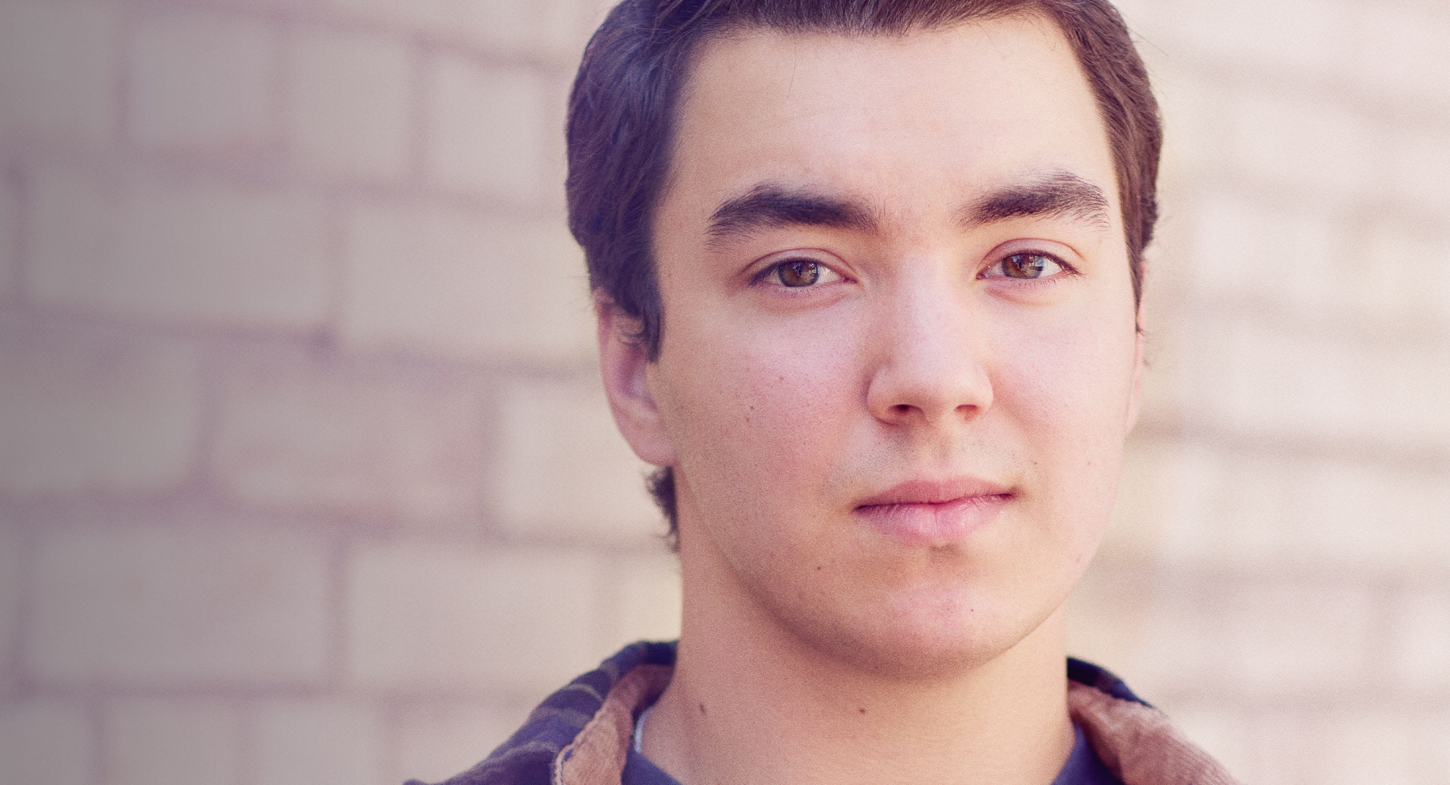 Young white man looking at camera