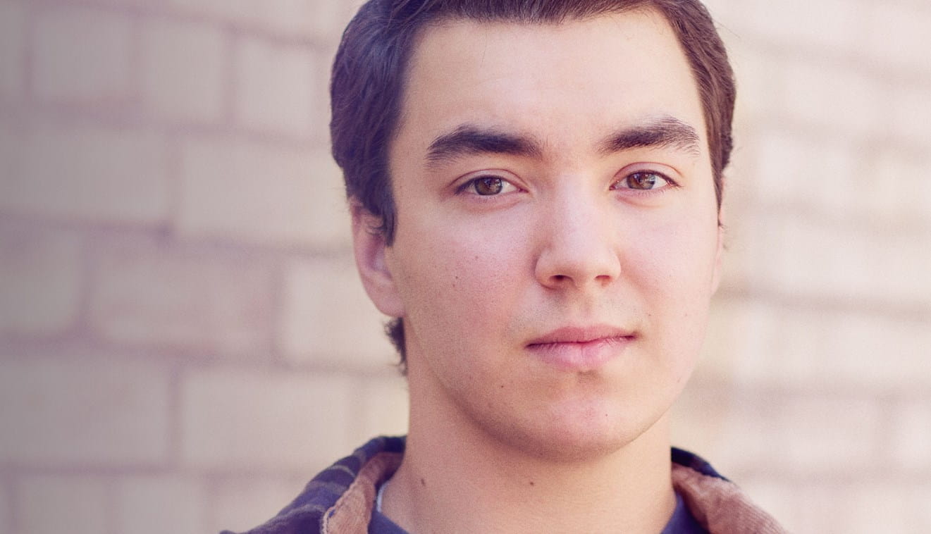 Young white man looking at camera