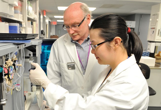 Dr. Jim Kennedy and Dr. Gwyneth Zai in laboratory