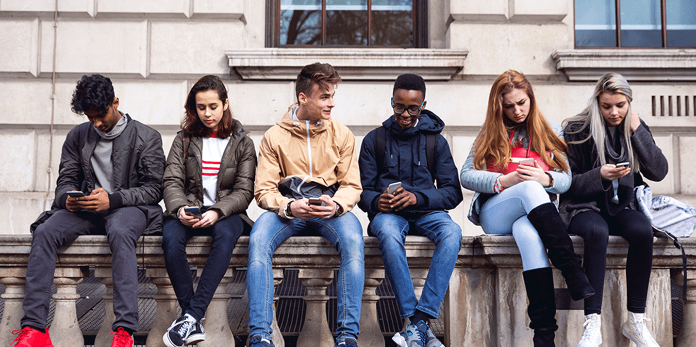 Group of youths sitting outdoors