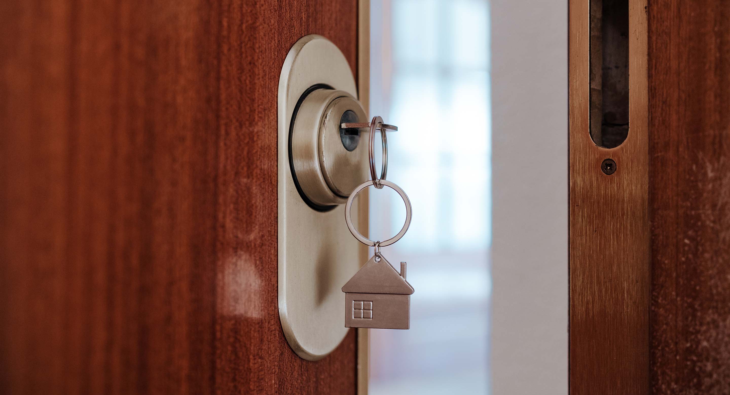 Key in a door that's slightly ajar