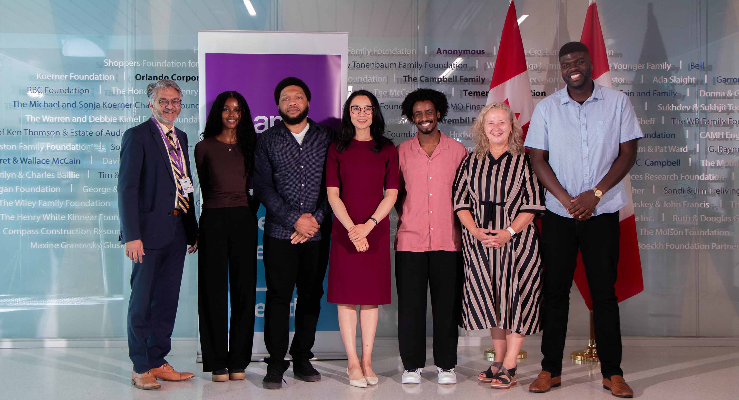 Parliamentary Secretary to the Minister of Health, Maggie Chi with Dr. Peter Selby, CAMH CEO Sarah Downey and members of AMANI and INTREPID Labs staff