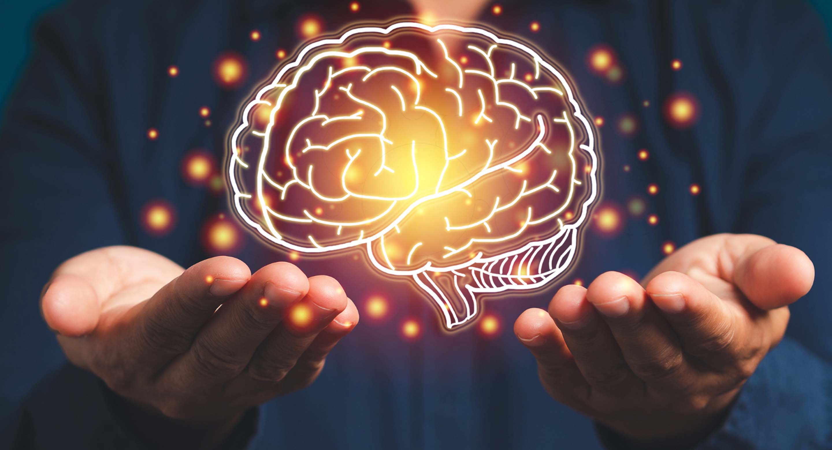 Image of a person holding up a virtual depiction of a brain