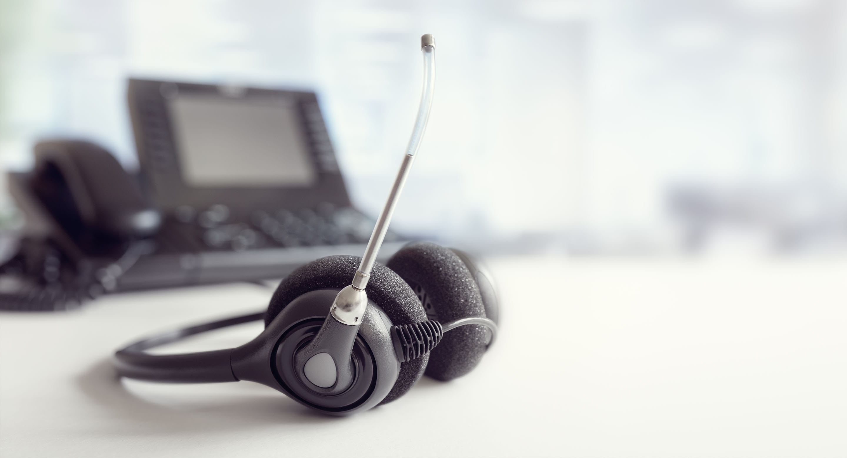 Phone headset sitting on a desk