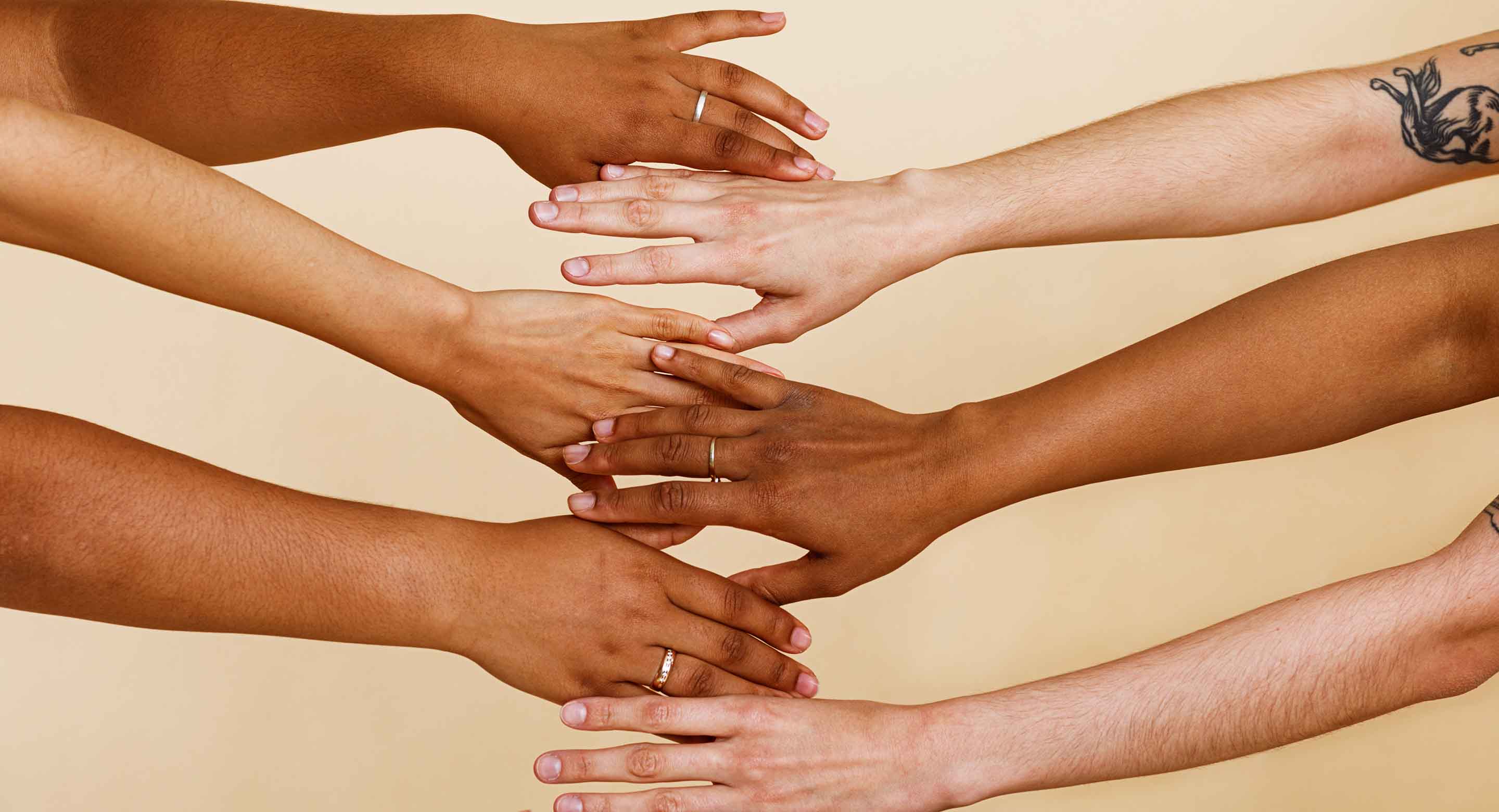 Photo of various women's hands holding each other