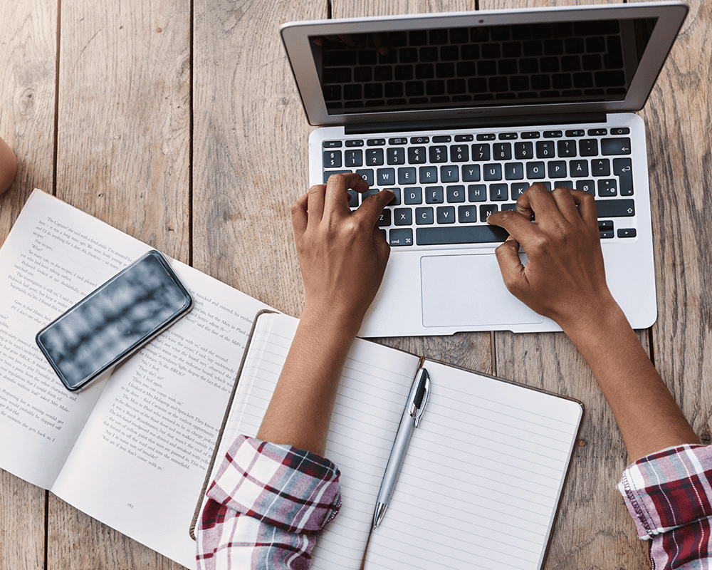 Person typing on a laptop